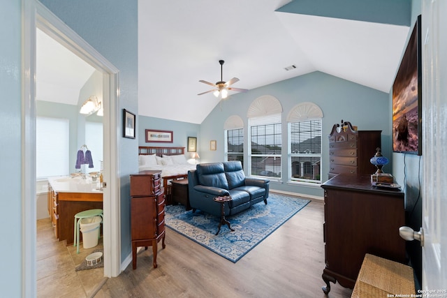 bedroom featuring hardwood / wood-style floors and vaulted ceiling