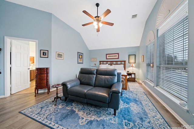 bedroom featuring light hardwood / wood-style flooring, ceiling fan, and lofted ceiling