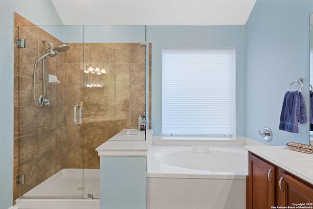 bathroom featuring separate shower and tub and vanity