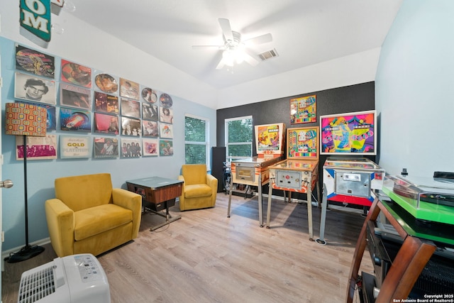 game room with ceiling fan and light hardwood / wood-style flooring