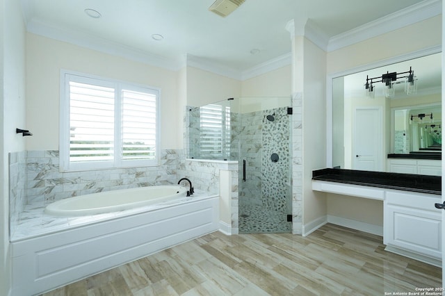 bathroom featuring plus walk in shower, hardwood / wood-style floors, vanity, and crown molding