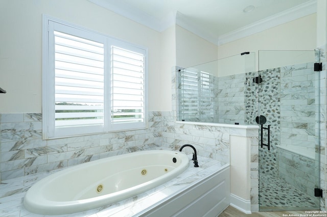 bathroom featuring a healthy amount of sunlight, separate shower and tub, and ornamental molding