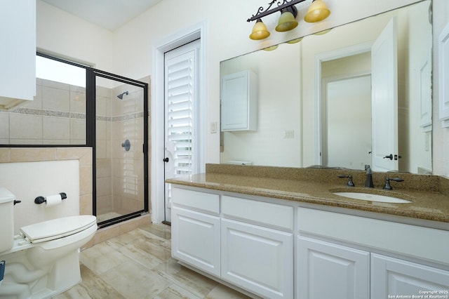 bathroom with a wealth of natural light, vanity, an enclosed shower, and toilet