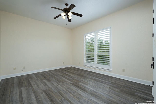 empty room featuring dark hardwood / wood-style floors and ceiling fan