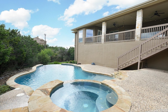 view of swimming pool featuring an in ground hot tub and ceiling fan