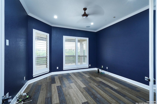 empty room with ceiling fan, ornamental molding, and dark wood-type flooring