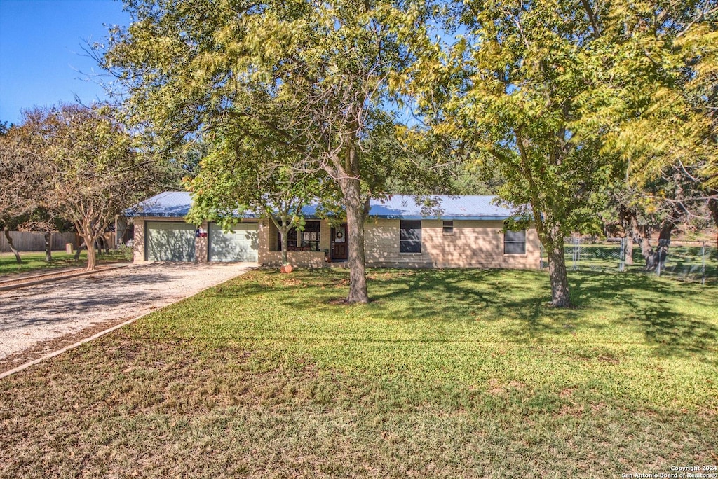 ranch-style house with a front lawn