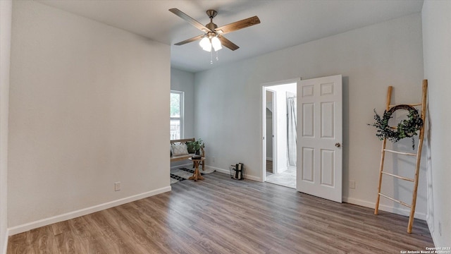 unfurnished room with ceiling fan and hardwood / wood-style floors