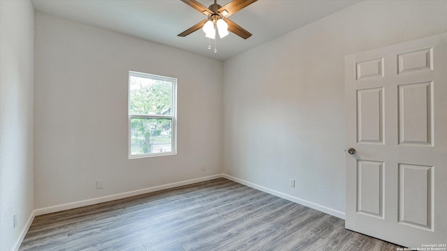 unfurnished room featuring ceiling fan and light hardwood / wood-style floors