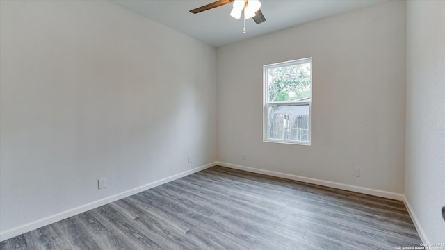 spare room with wood-type flooring and ceiling fan