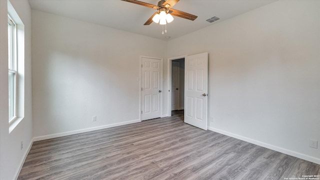 unfurnished room with ceiling fan and light hardwood / wood-style floors