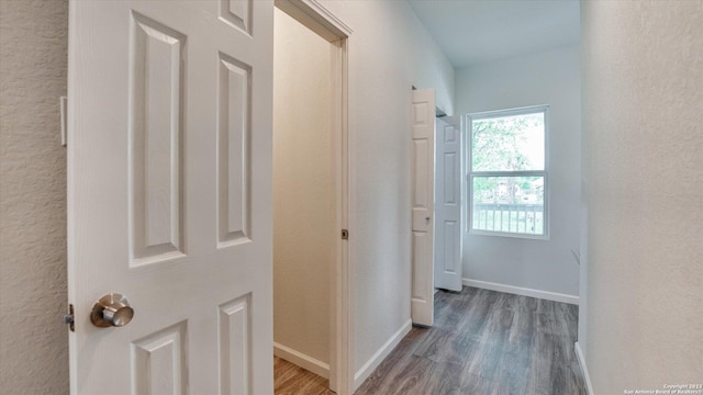 corridor featuring dark wood-type flooring