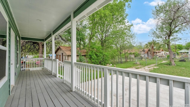 wooden terrace featuring covered porch