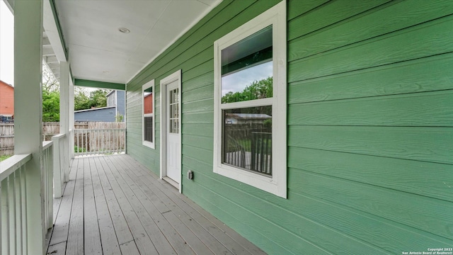 wooden terrace with a porch