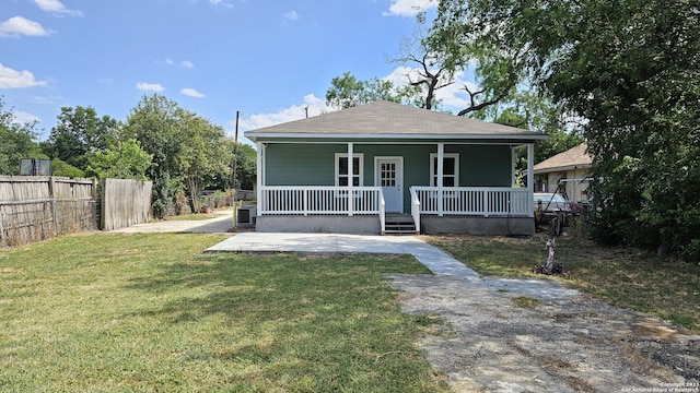 bungalow-style house with covered porch and a front yard