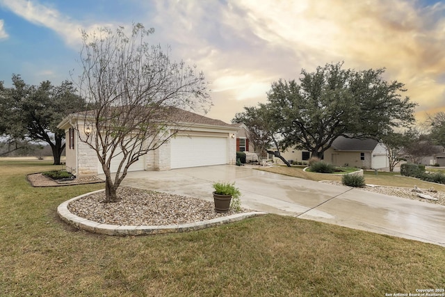 view of front of home featuring a garage and a lawn