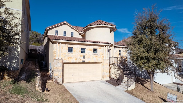 mediterranean / spanish home featuring a garage