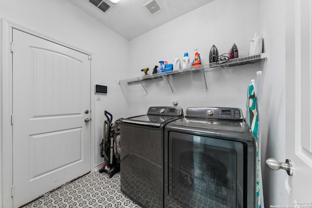 laundry area featuring washing machine and dryer