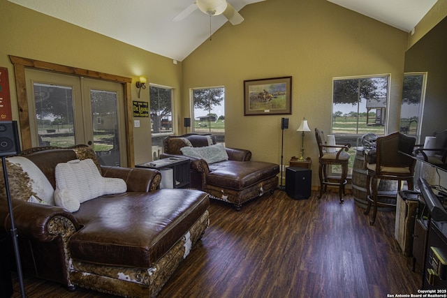 living room featuring high vaulted ceiling, dark wood-type flooring, and ceiling fan