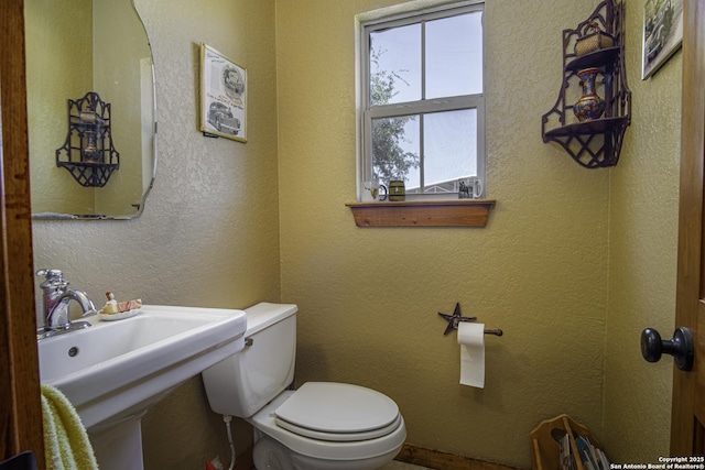 bathroom with sink and toilet