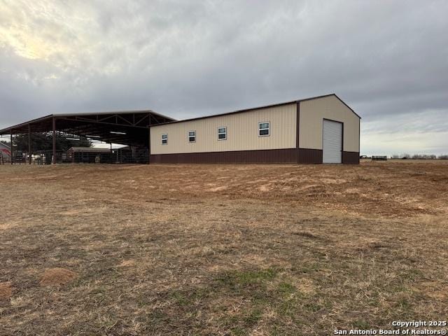 exterior space with a garage and an outdoor structure