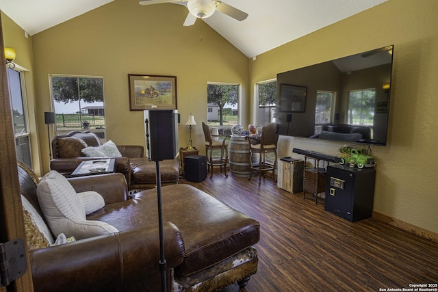 living room with lofted ceiling, dark wood-type flooring, and ceiling fan