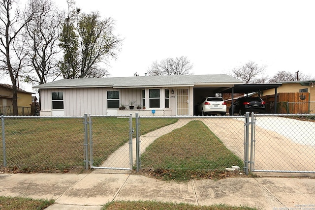 view of front of house featuring a carport and a front lawn