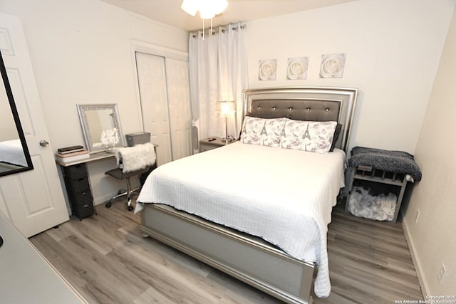 bedroom featuring hardwood / wood-style flooring and a closet