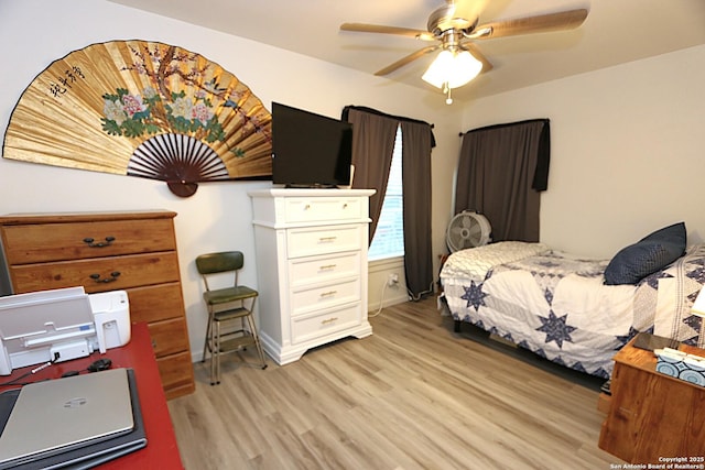 bedroom featuring ceiling fan and light hardwood / wood-style floors