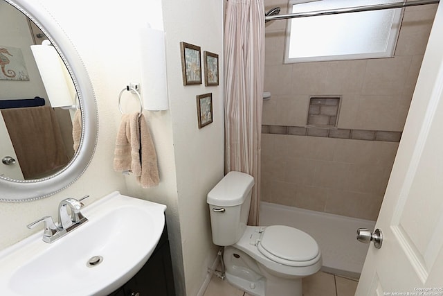 bathroom with tile patterned floors, vanity, toilet, and walk in shower