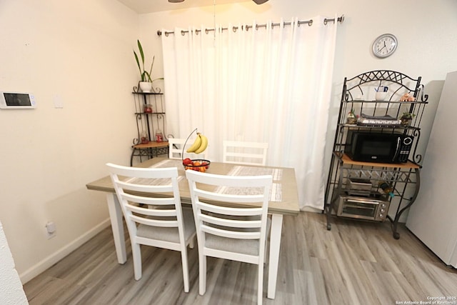 dining area featuring hardwood / wood-style flooring