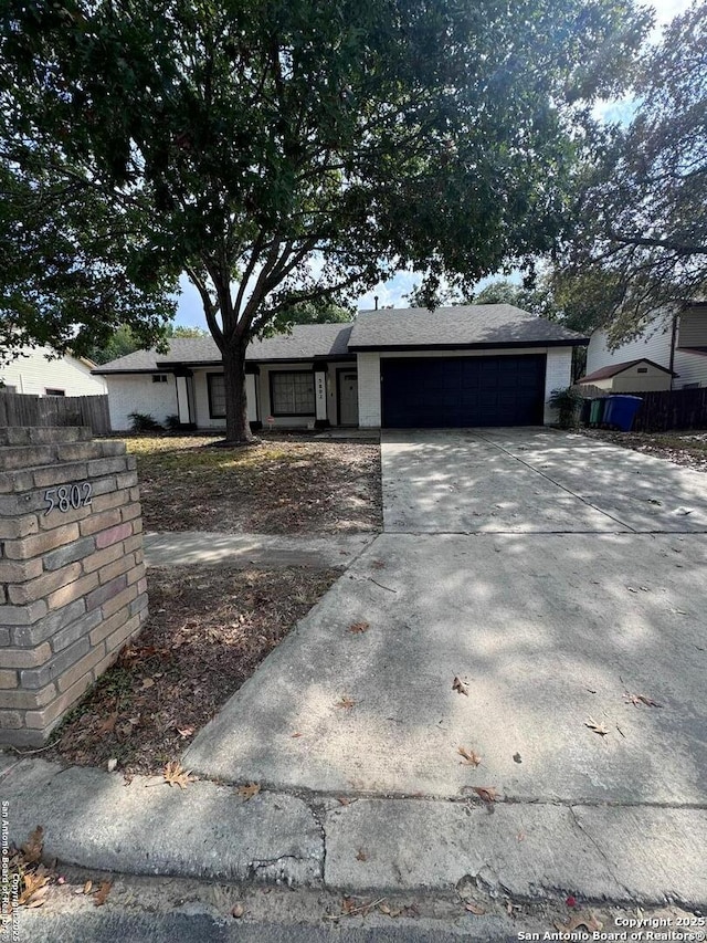 single story home featuring a garage