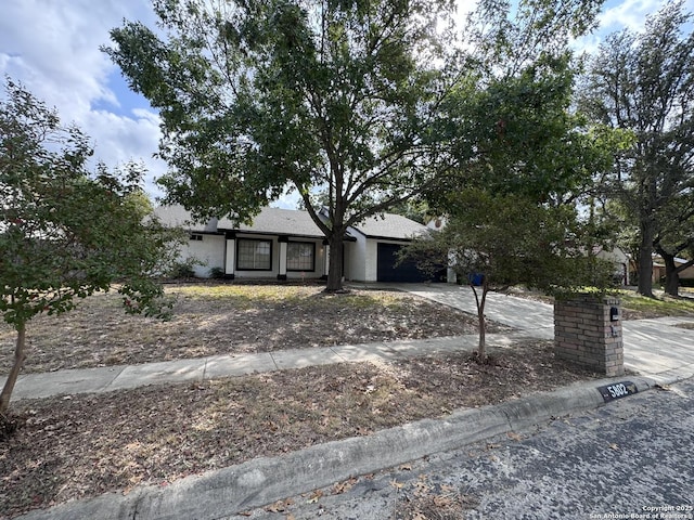 ranch-style house featuring a garage