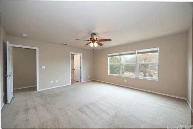 unfurnished room with light carpet and ceiling fan