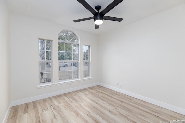 unfurnished room with ceiling fan and light hardwood / wood-style flooring