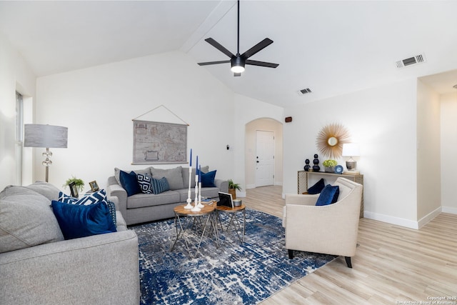 living room with vaulted ceiling with beams, ceiling fan, and light hardwood / wood-style flooring