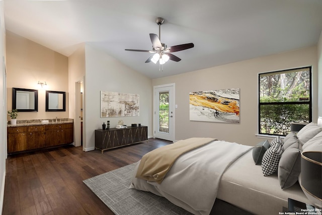 bedroom featuring access to exterior, ensuite bath, vaulted ceiling, ceiling fan, and dark hardwood / wood-style floors