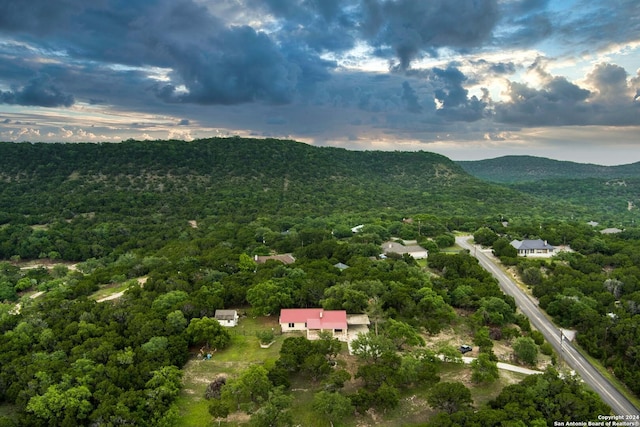 aerial view at dusk featuring a mountain view