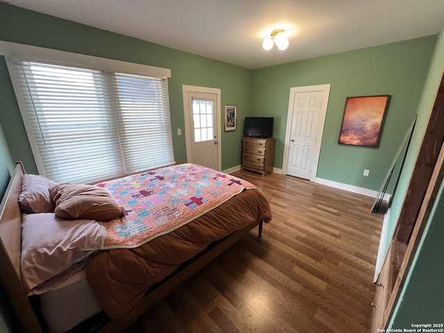 bedroom featuring dark hardwood / wood-style flooring