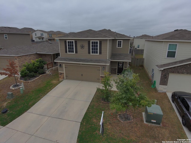 traditional-style house with a residential view, driveway, and an attached garage