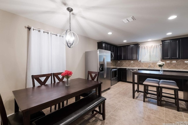 dining space with a notable chandelier