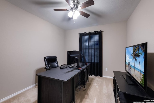 carpeted home office with ceiling fan