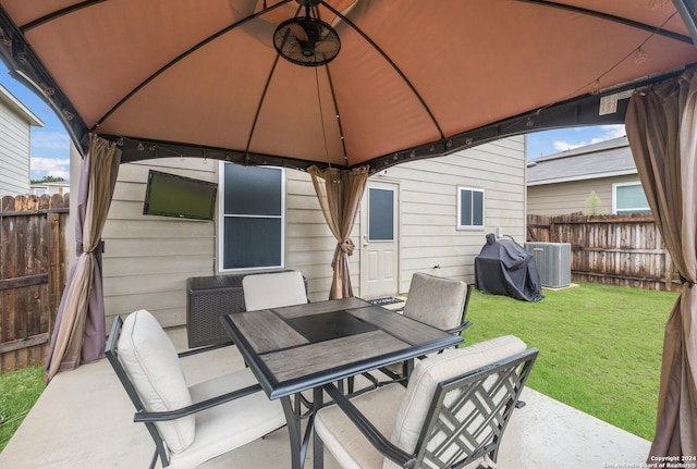 view of patio / terrace featuring a gazebo, area for grilling, and central AC unit