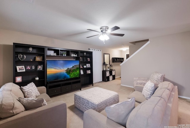 carpeted living room featuring ceiling fan