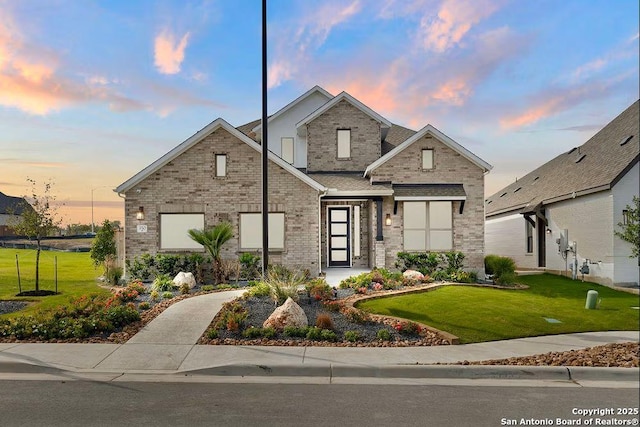 view of front of home with a yard