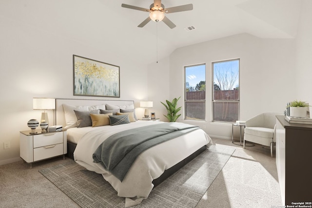 bedroom with vaulted ceiling, ceiling fan, and carpet flooring