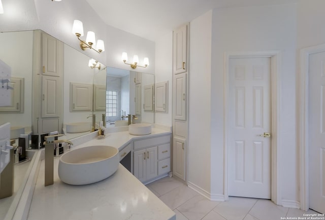 bathroom with tile patterned flooring and vanity