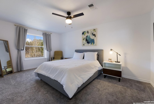 bedroom with ceiling fan and dark carpet