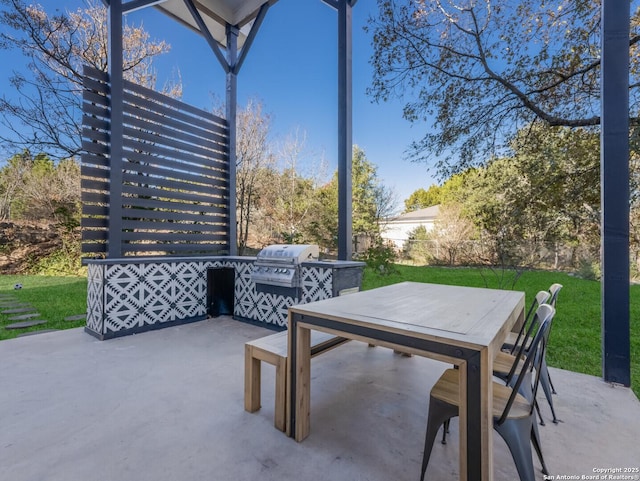 view of patio with grilling area and exterior kitchen