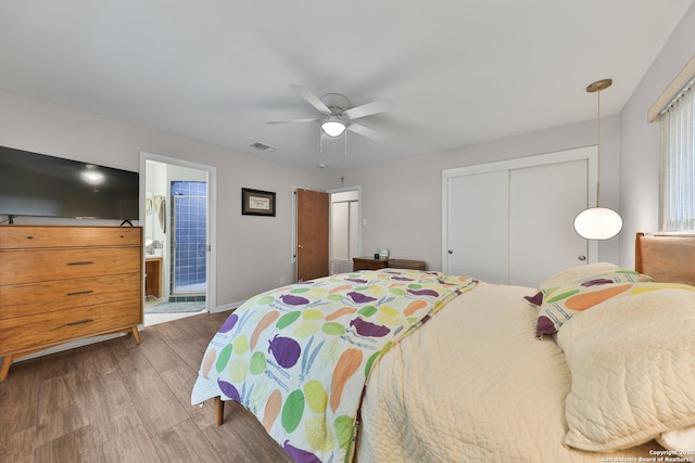 bedroom featuring connected bathroom, ceiling fan, and hardwood / wood-style floors